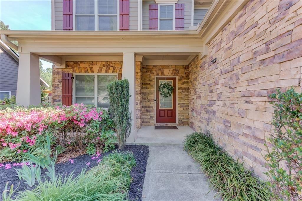 7772 Copper Kettle Way Flowery Branch, GA 30542 - Photo 3 of 43 a front view of a house