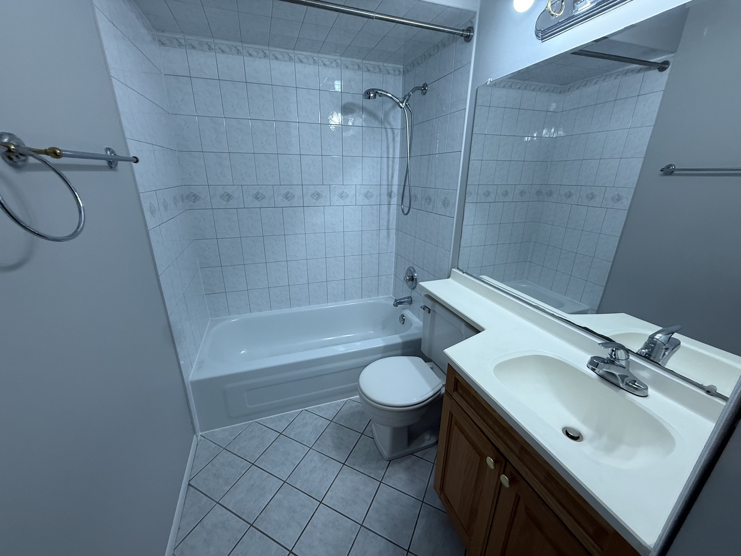 744 West Gordon Terrace, Unit 305 Chicago, IL 60613 - Photo 12 of 12 a bathroom with a sink toilet and shower