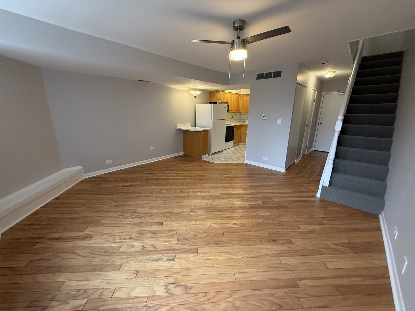 744 West Gordon Terrace, Unit 305 Chicago, IL 60613 - Photo 3 of 12 a view of a hallway with wooden floor
