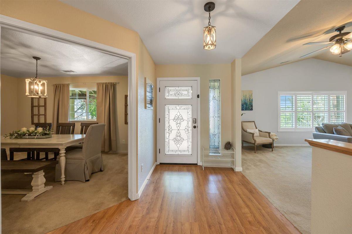 2441 Quail Hill Road, Unit 262 Copperopolis, CA 95228 - Photo 12 of 90 a view of a livingroom with furniture hardwood floor and a ceiling fan