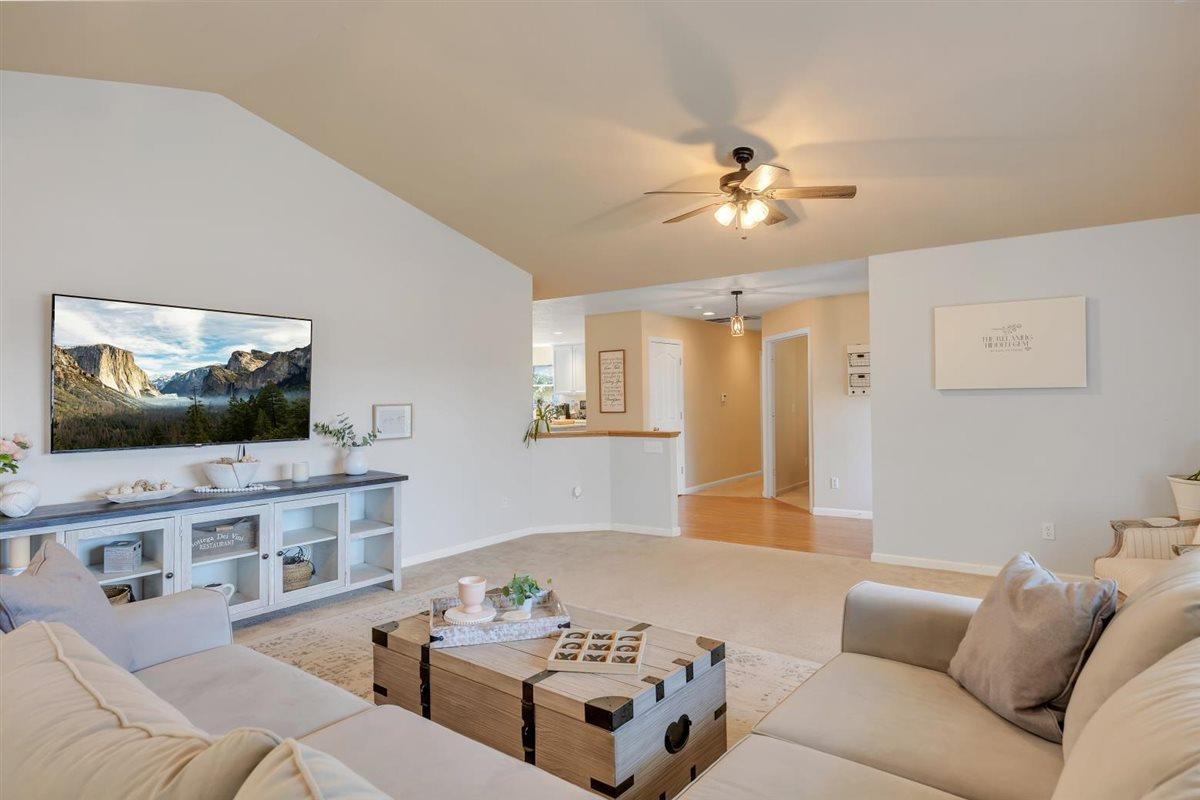 2441 Quail Hill Road, Unit 262 Copperopolis, CA 95228 - Photo 90 of 90 a living room with furniture and a flat screen tv