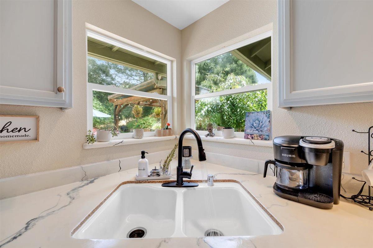 2441 Quail Hill Road, Unit 262 Copperopolis, CA 95228 - Photo 21 of 90 a bathroom with a sink a large window and a sink