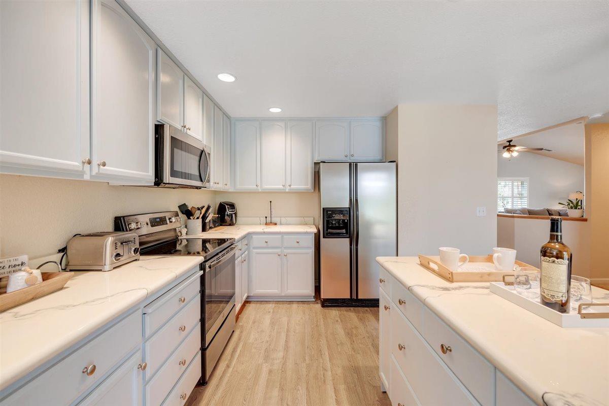 2441 Quail Hill Road, Unit 262 Copperopolis, CA 95228 - Photo 22 of 90 a kitchen with a sink cabinets and stainless steel appliances