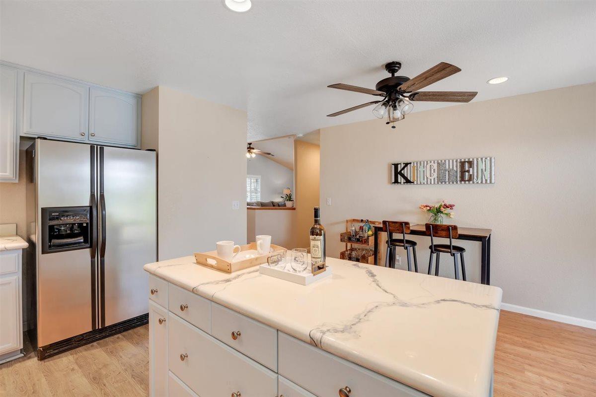 2441 Quail Hill Road, Unit 262 Copperopolis, CA 95228 - Photo 23 of 90 a kitchen with kitchen island a counter space a sink appliances and cabinets