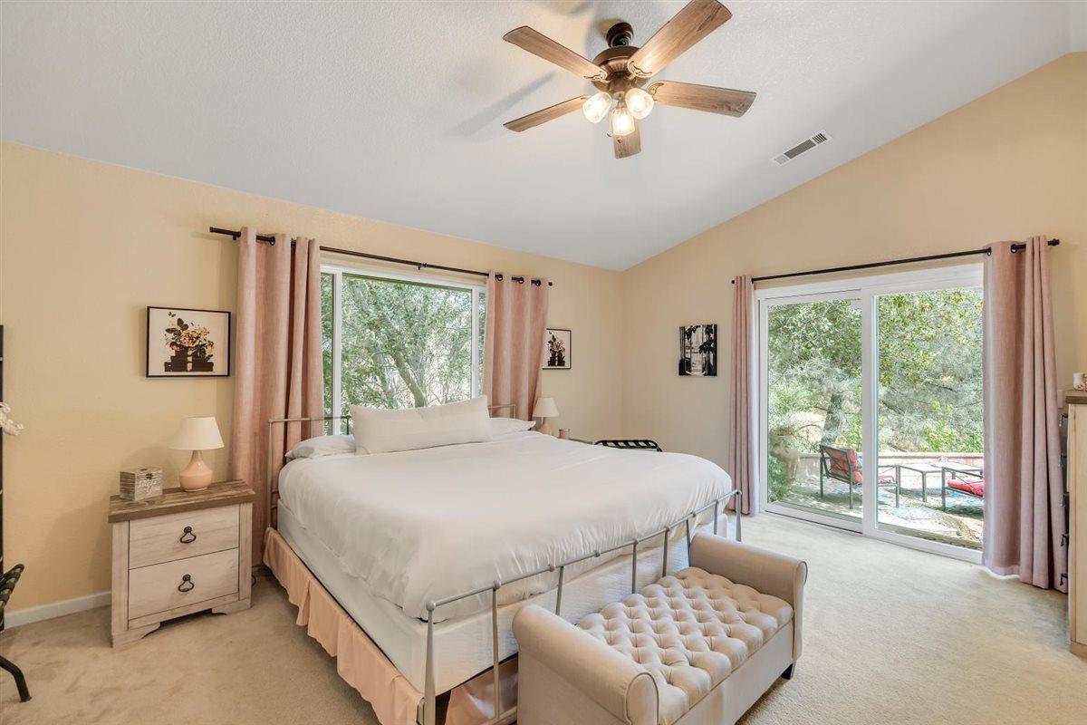 2441 Quail Hill Road, Unit 262 Copperopolis, CA 95228 - Photo 26 of 90 a bedroom with a large bed and a window