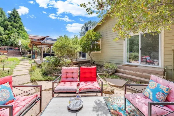 a view of an outdoor sitting area with furniture