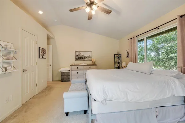 a view of a patio with table and chairs under an umbrella with wooden floor