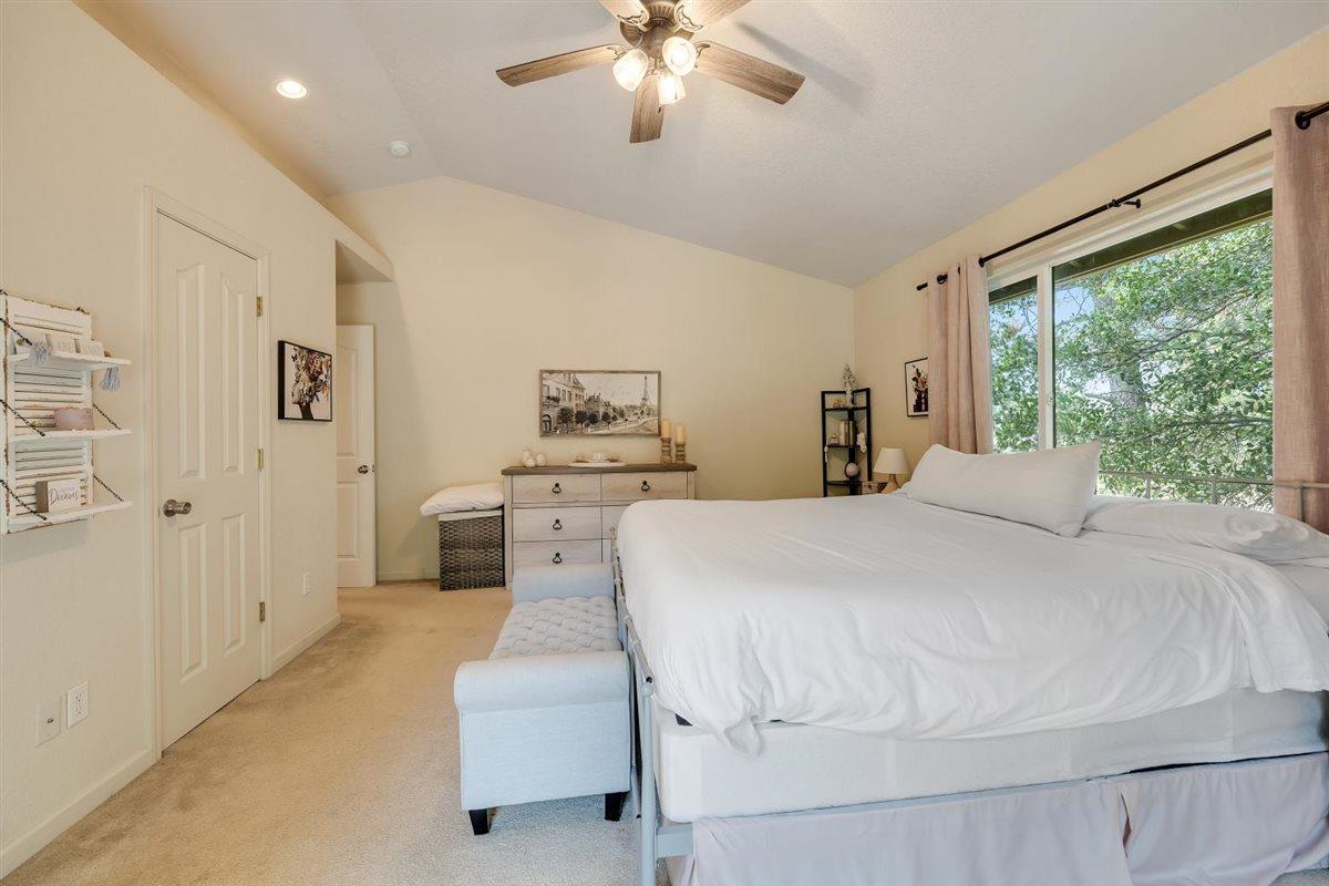 2441 Quail Hill Road, Unit 262 Copperopolis, CA 95228 - Photo 30 of 90 a bed room with a bed and a chandelier