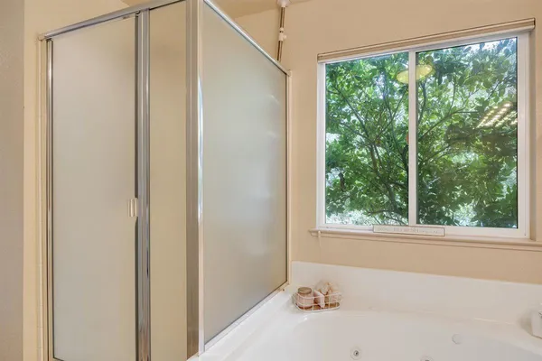 an aerial view of a house with garden space and street view