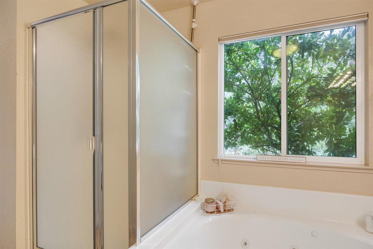 2441 Quail Hill Road, Unit 262 Copperopolis, CA 95228 - Photo 35 of 90 a view of a bathroom with a window and a ceiling fan