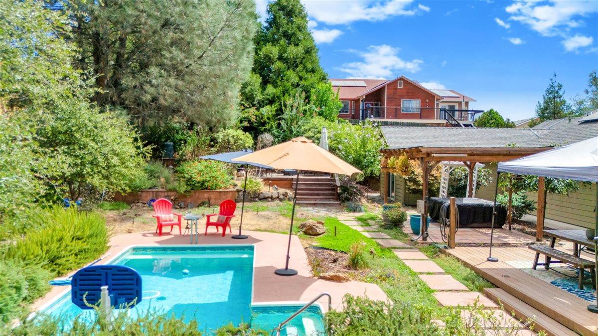 2441 Quail Hill Road, Unit 262 Copperopolis, CA 95228 - Photo 54 of 90 a view of an chairs and table in patio with a fire pit