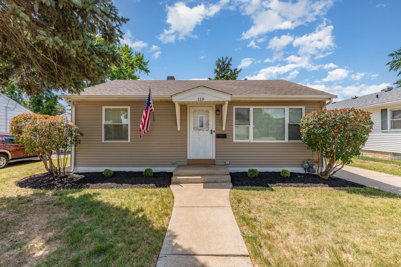 119 Riverside Drive Montgomery, IL 60538 - Photo 1 of 18 a front view of a house with a yard