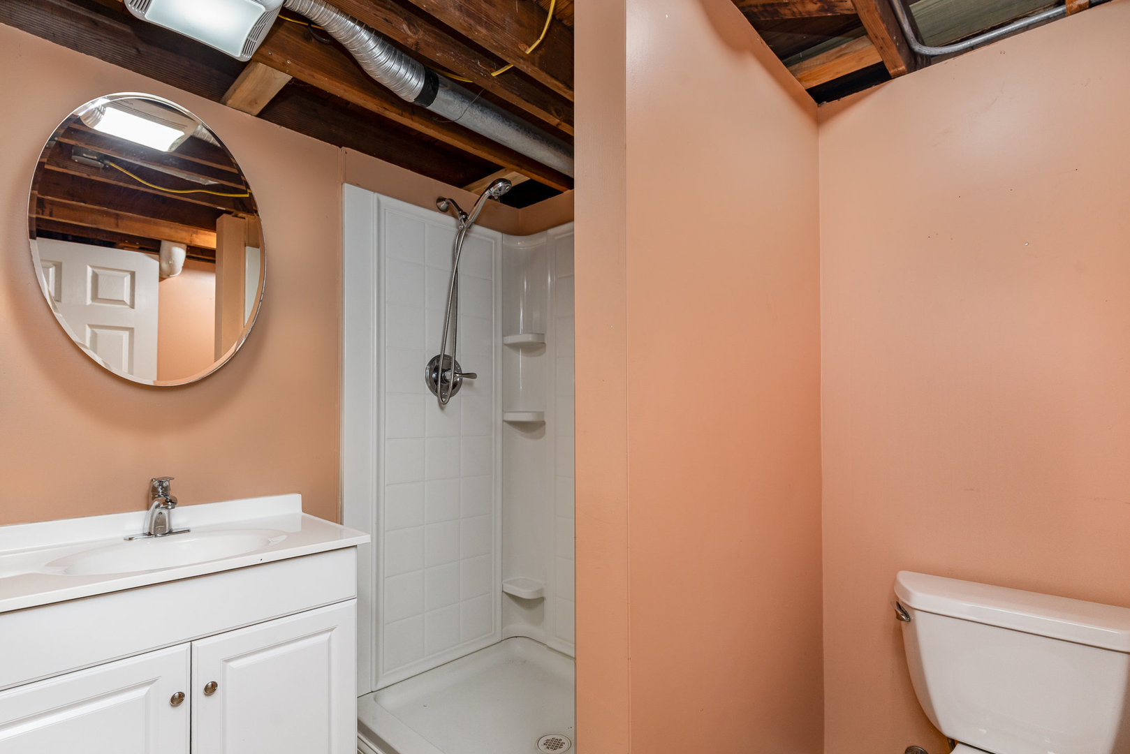 119 Riverside Drive Montgomery, IL 60538 - Photo 13 of 18 a bathroom with a toilet a sink and mirror