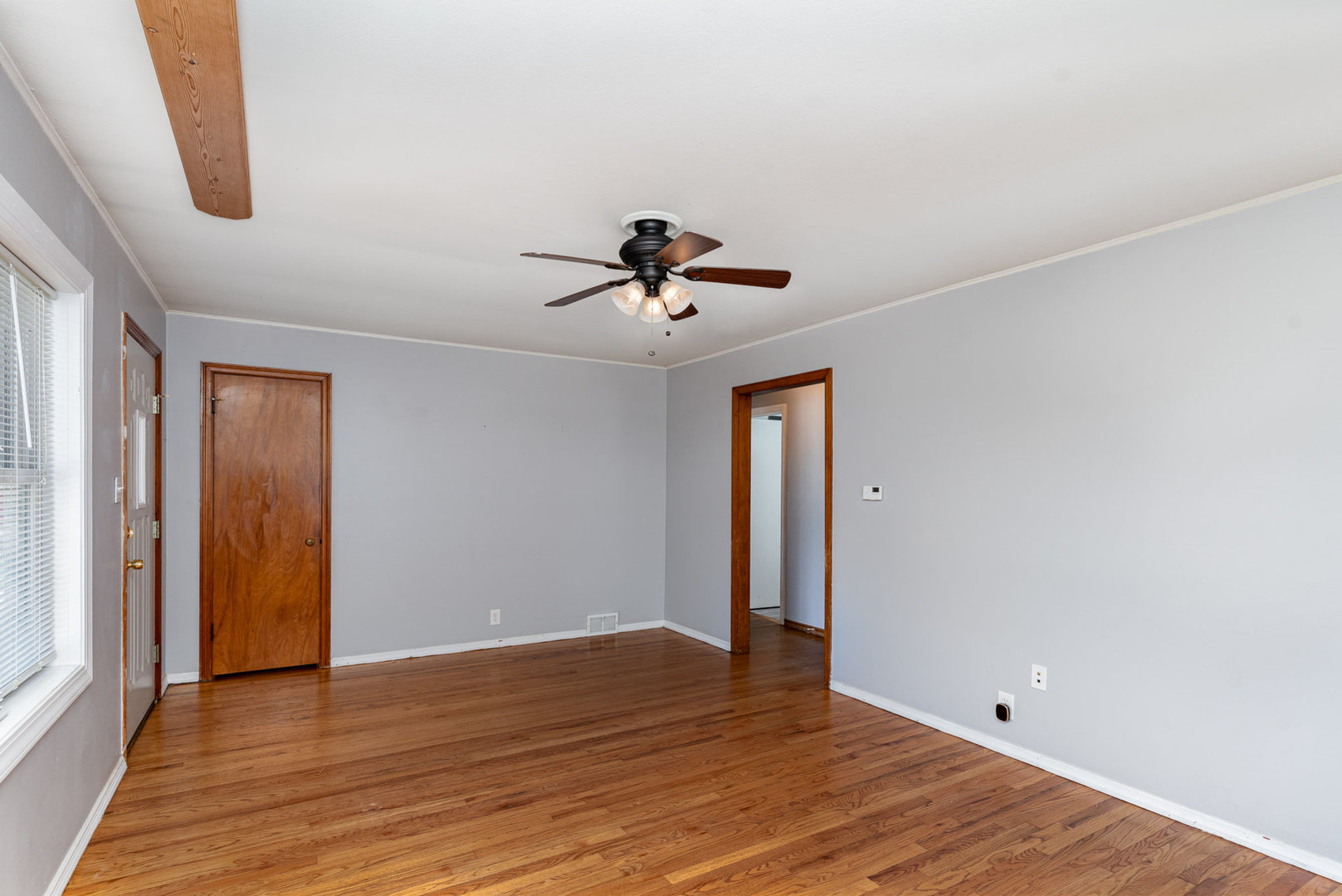 119 Riverside Drive Montgomery, IL 60538 - Photo 3 of 18 a view of room with wooden floor and ceiling fan