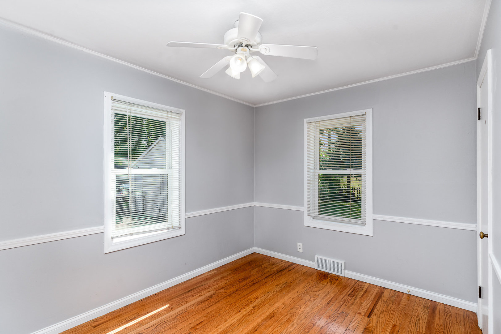 119 Riverside Drive Montgomery, IL 60538 - Photo 6 of 18 a view of an empty room with a window and wooden floor