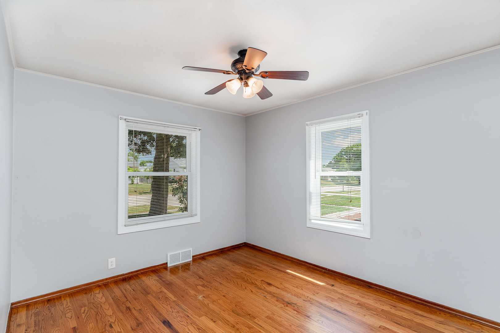 119 Riverside Drive Montgomery, IL 60538 - Photo 8 of 18 an empty room with windows and fan