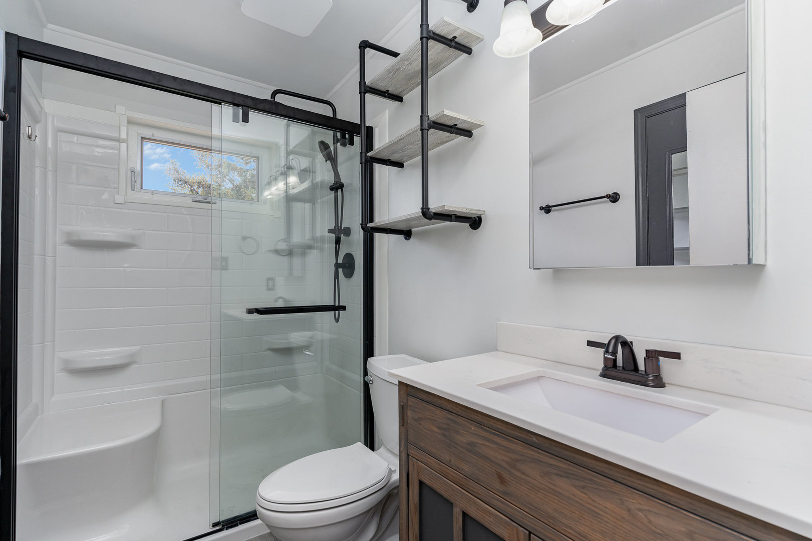 119 Riverside Drive Montgomery, IL 60538 - Photo 10 of 18 a bathroom with a granite countertop sink toilet and shower