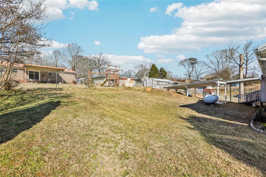3014 Bronco Lane Gainesville, GA 30507 - Photo 34 of 37 a view of a house with a yard