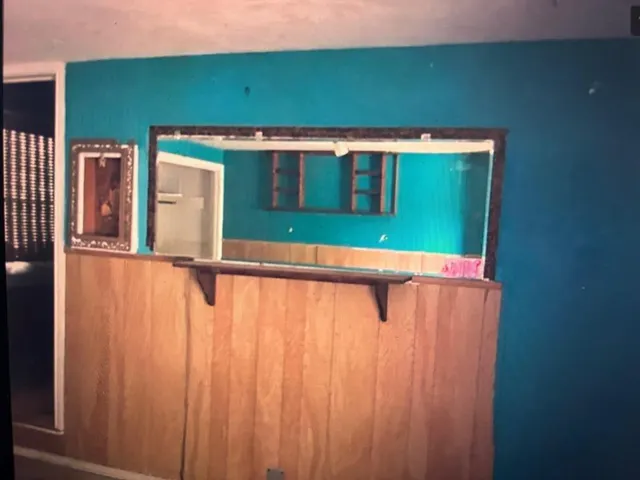 a kitchen with a sink cabinets appliances and a window