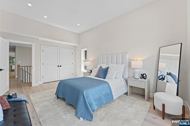 a spacious bedroom with a bed and a couch