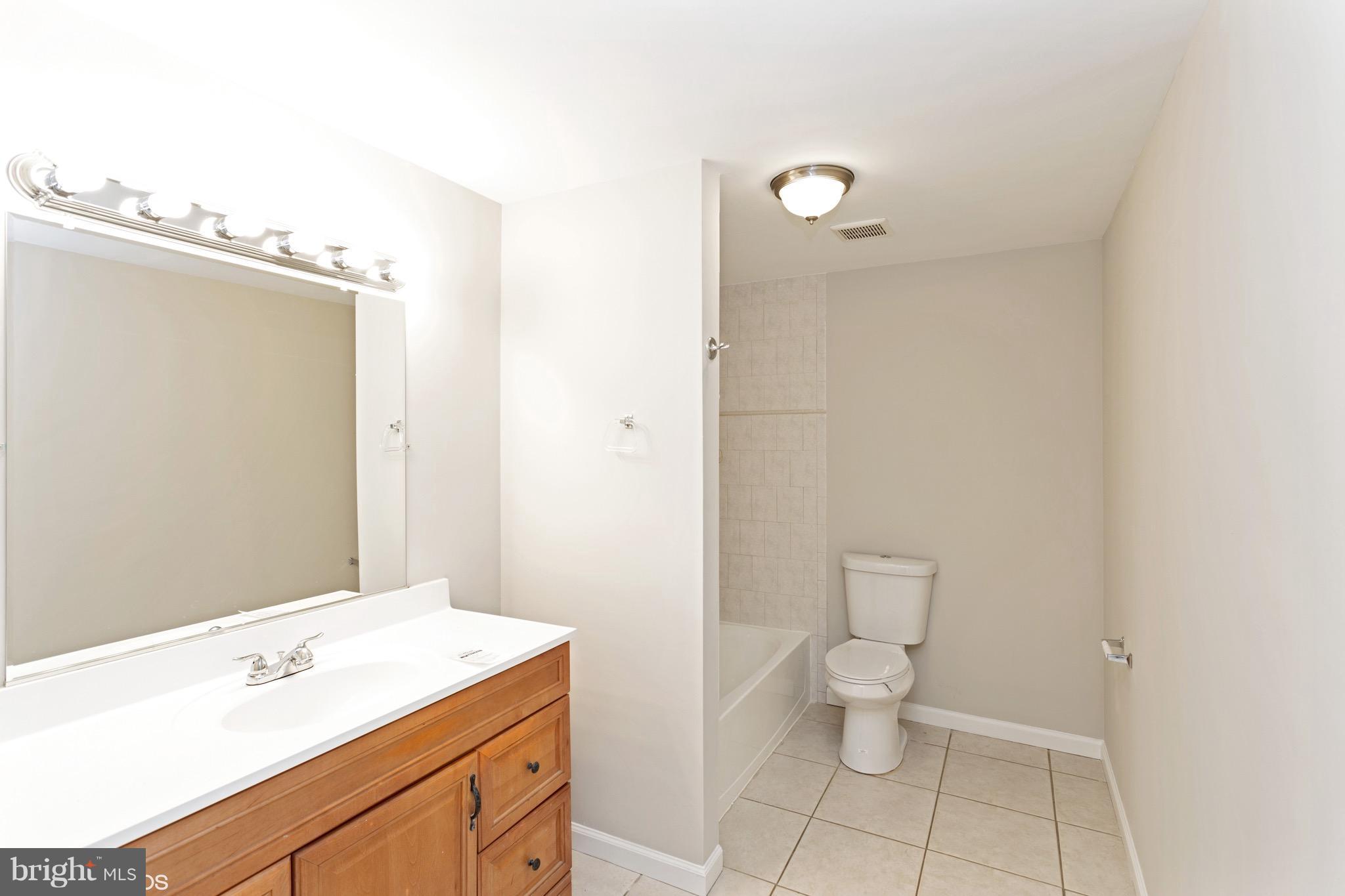 22 Ridgeway Road Stafford, VA 22556 - Photo 14 of 28 a bathroom with a sink a toilet and a mirror