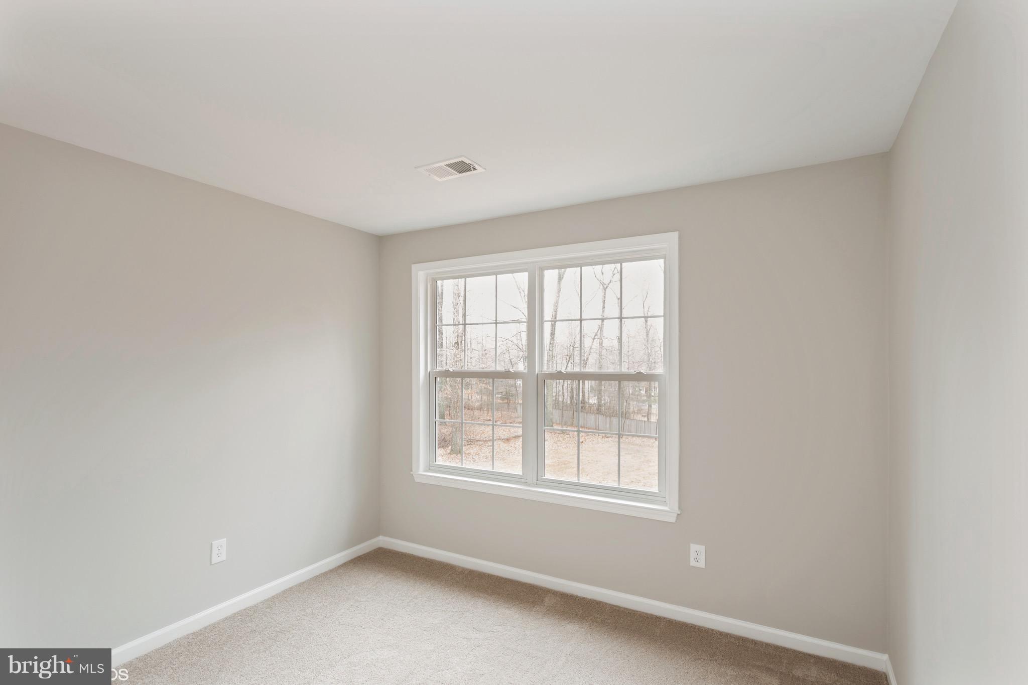 22 Ridgeway Road Stafford, VA 22556 - Photo 22 of 28 an empty room with windows