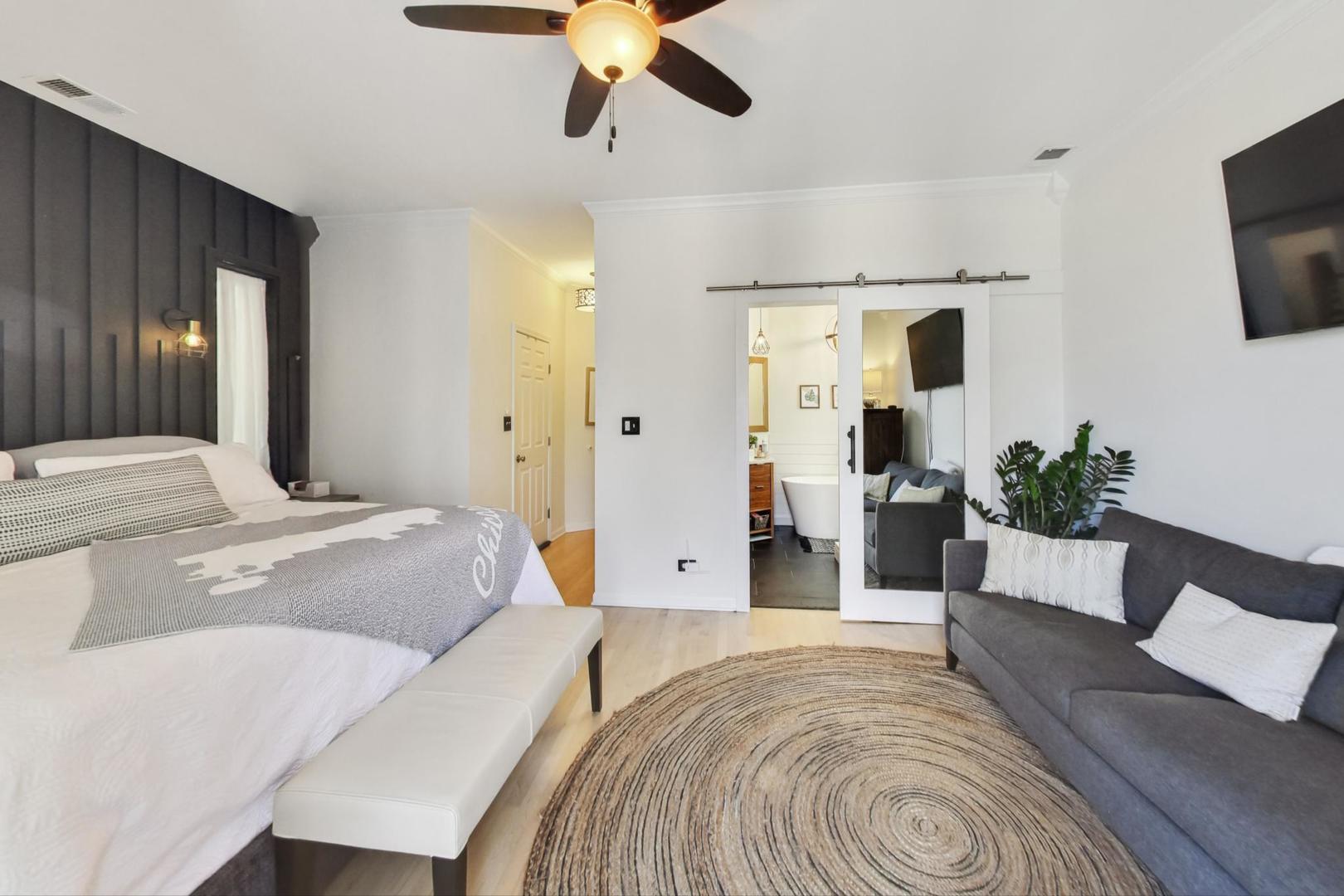 952 West Barry Avenue, Unit 2 Chicago, IL 60657 - Photo 14 of 24 a spacious bedroom with a bed and a flat screen tv