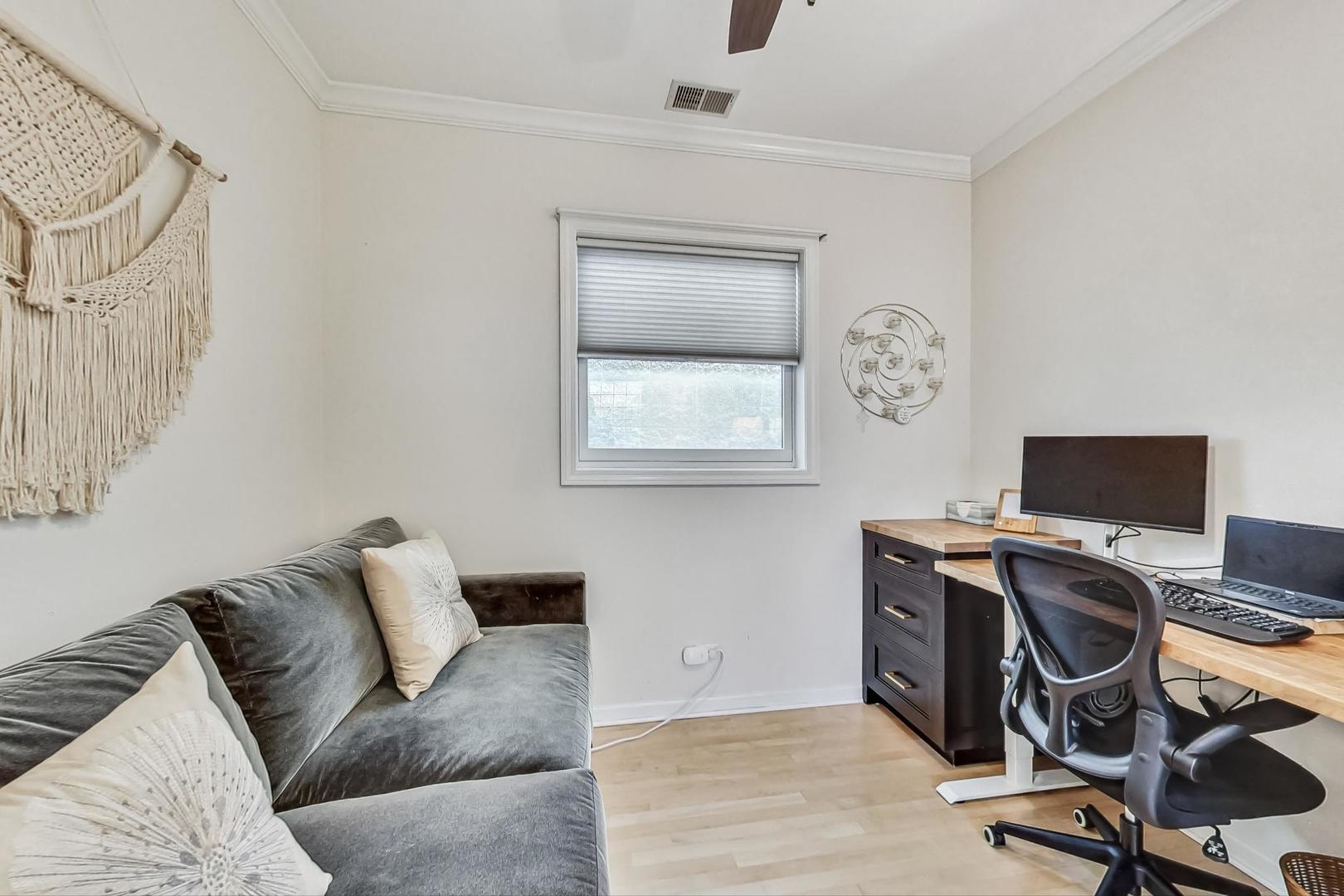 952 West Barry Avenue, Unit 2 Chicago, IL 60657 - Photo 19 of 24 a view of workspace with wooden floor outdoor seating and view living room