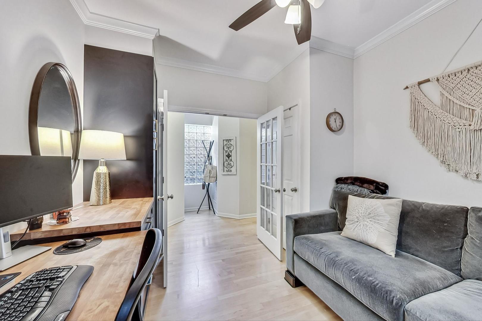 952 West Barry Avenue, Unit 2 Chicago, IL 60657 - Photo 20 of 24 a living room with furniture and a flat screen tv