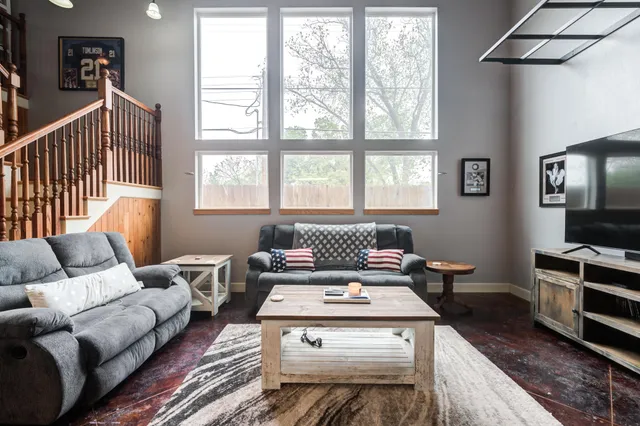 a living room with furniture and a window