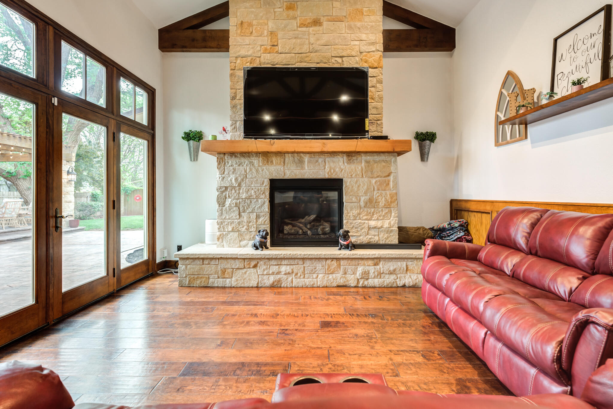 4510 21st Street Lubbock, TX 79407 - Photo 2 of 17 a living room with furniture and a fireplace