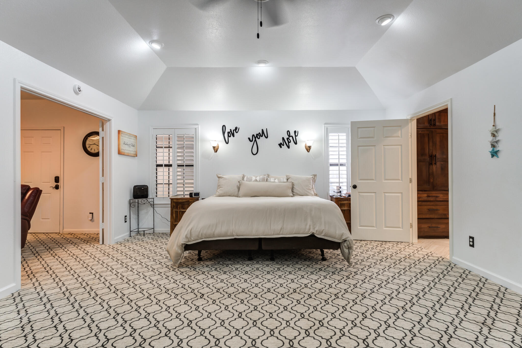 4510 21st Street Lubbock, TX 79407 - Photo 7 of 17 a spacious bedroom with a bed and a refrigerator