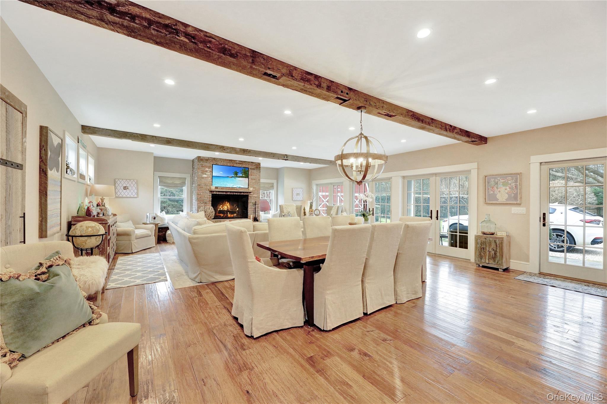 198 South Country Road Remsenburg, NY 11960 - Photo 9 of 49 a living room with fireplace furniture and a wooden floor