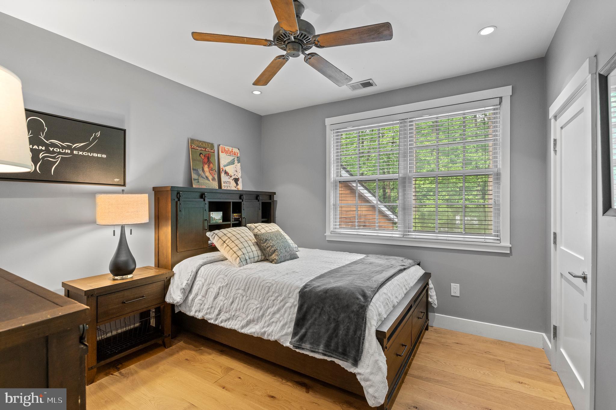 25 Bodine Road Berwyn, PA 19312 - Photo 38 of 73 a bedroom with a bed and a lamp on dresser