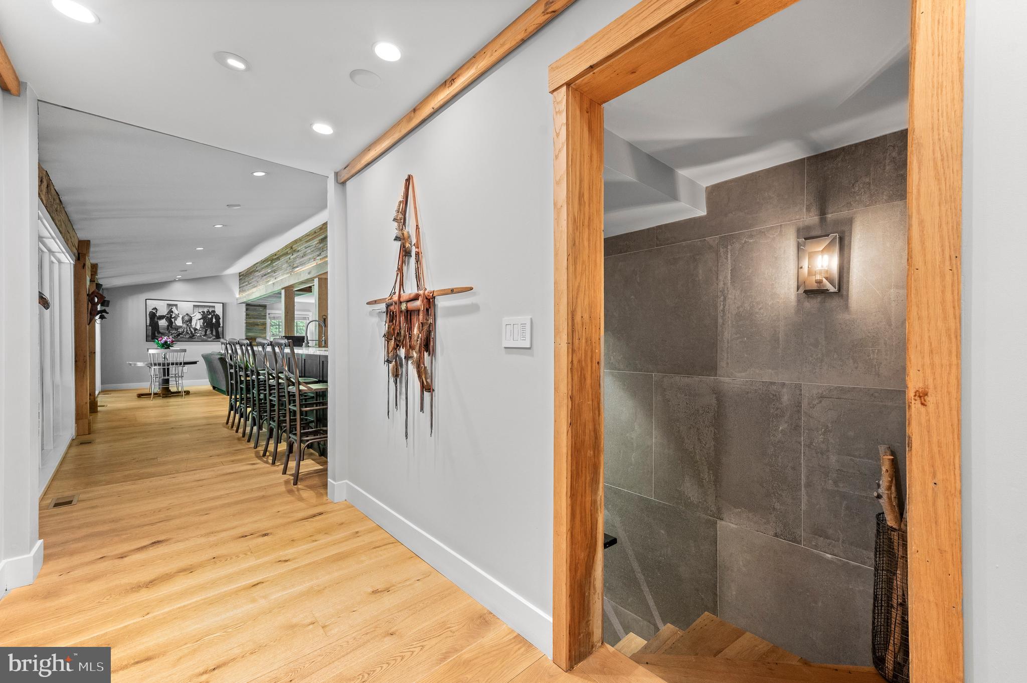 25 Bodine Road Berwyn, PA 19312 - Photo 42 of 73 a view of a hallway with dining area and chandelier