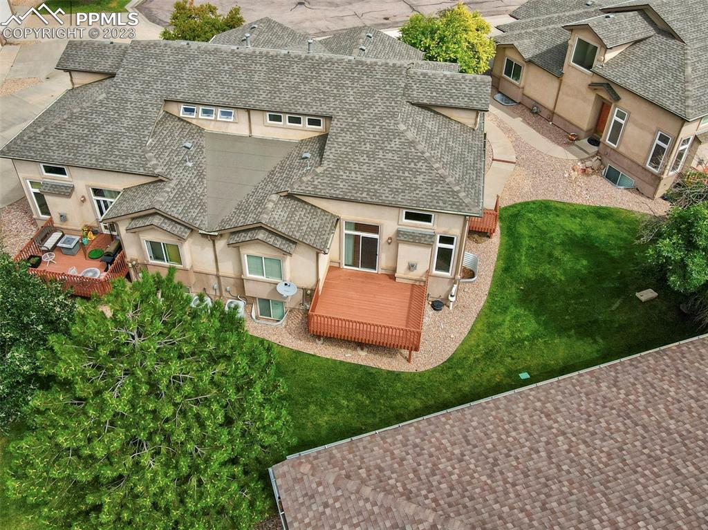 aerial view of a house with a yard