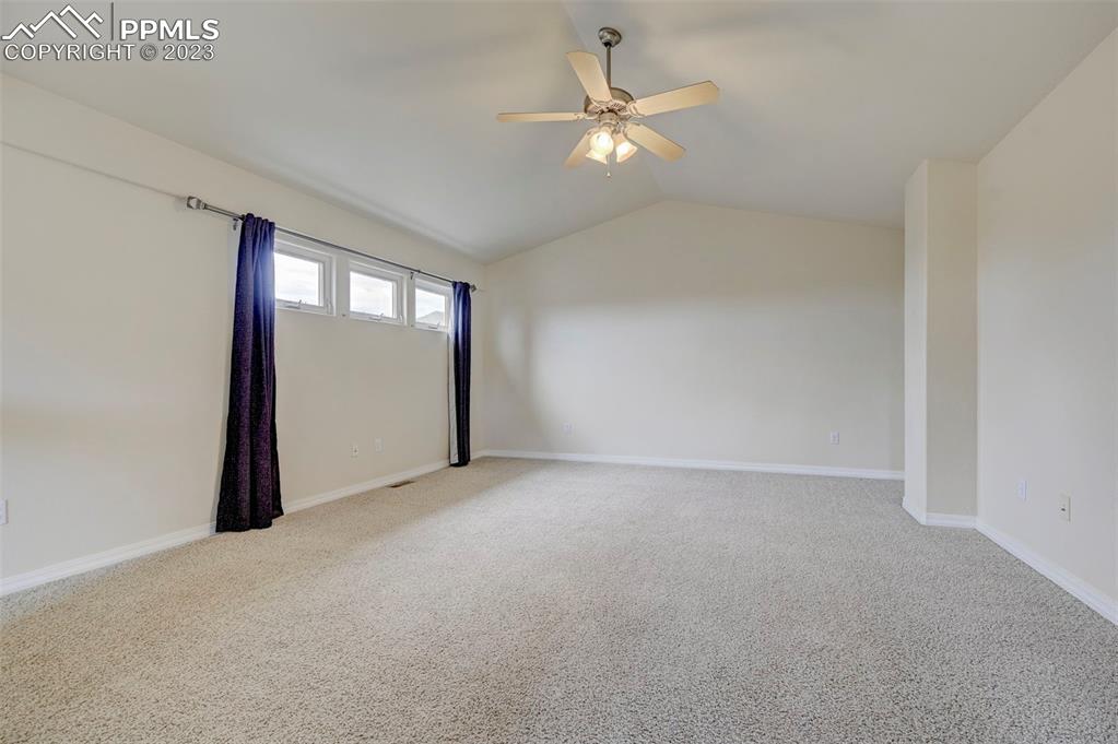 2170 Alpine Shadows View Colorado Springs, CO 80919 - Photo 11 of 49 an empty room with windows and fan