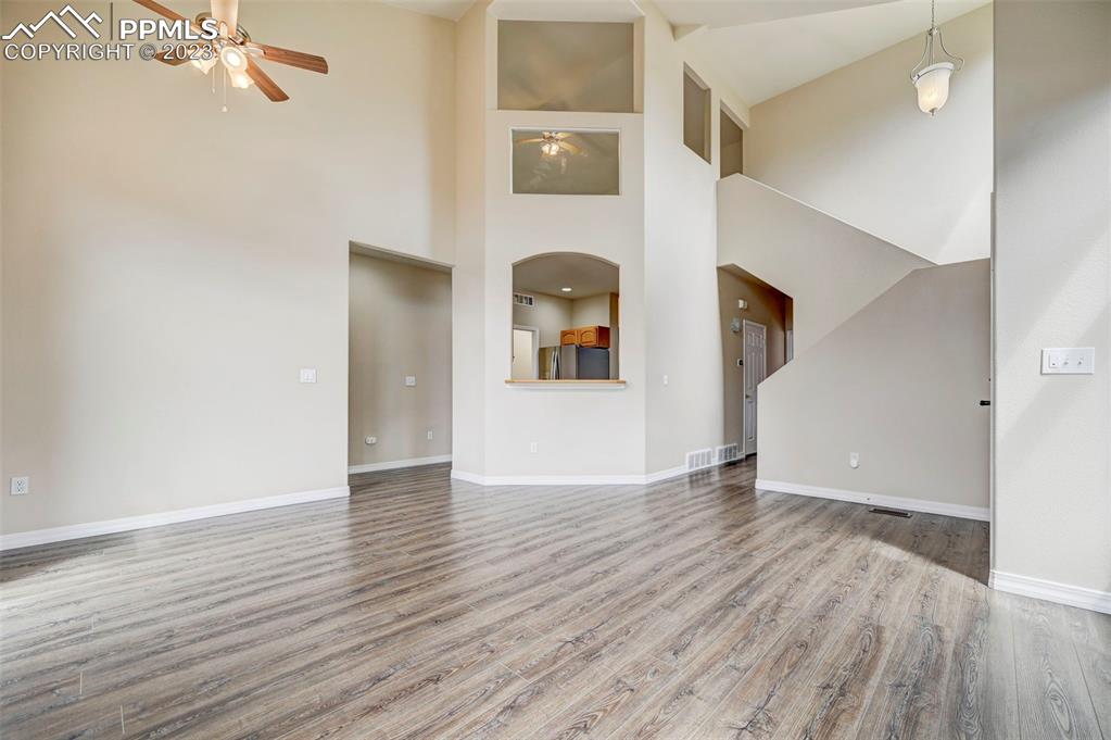 2170 Alpine Shadows View Colorado Springs, CO 80919 - Photo 20 of 49 a view of an empty room with wooden floor and a window