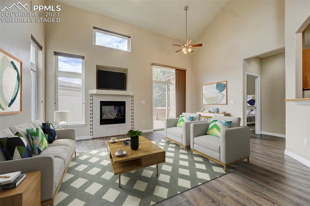 2170 Alpine Shadows View Colorado Springs, CO 80919 - Photo 2 of 49 a living room with furniture and a fireplace