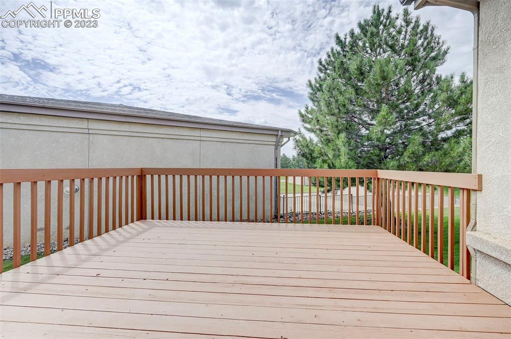 2170 Alpine Shadows View Colorado Springs, CO 80919 - Photo 21 of 49 a balcony with a wooden floor