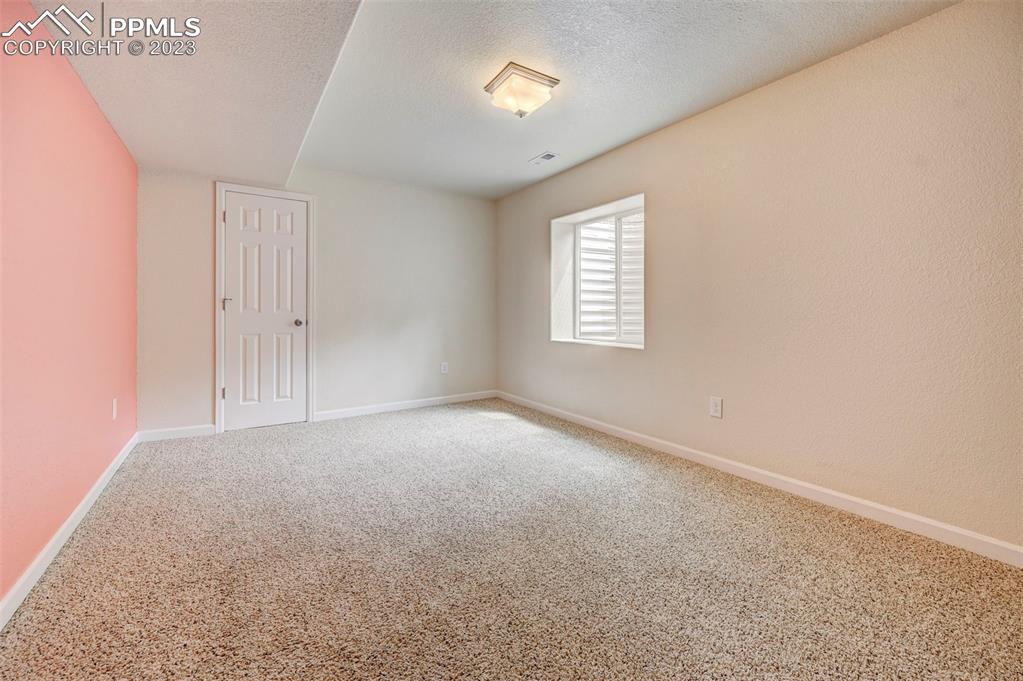 2170 Alpine Shadows View Colorado Springs, CO 80919 - Photo 37 of 49 an empty room with windows