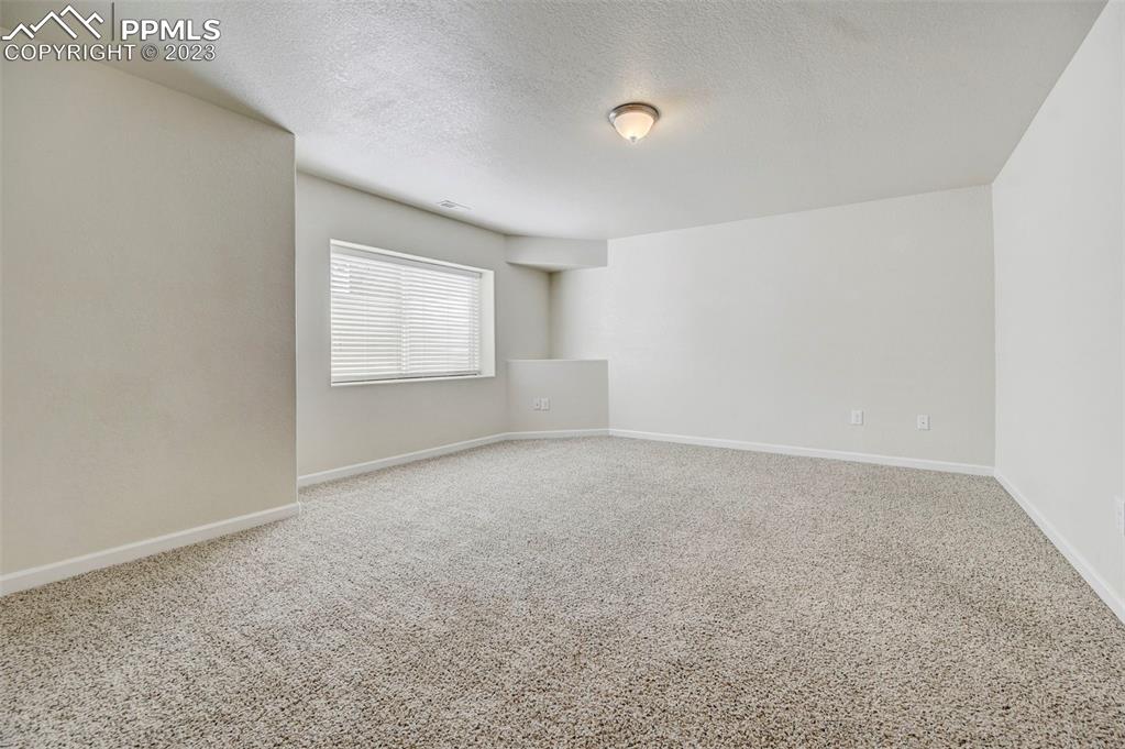 2170 Alpine Shadows View Colorado Springs, CO 80919 - Photo 39 of 49 an empty room with windows