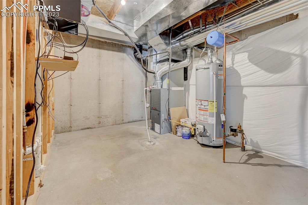 2170 Alpine Shadows View Colorado Springs, CO 80919 - Photo 40 of 49 a view of a room with gym equipment