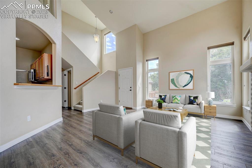 2170 Alpine Shadows View Colorado Springs, CO 80919 - Photo 4 of 49 a living room with fireplace furniture and a large window