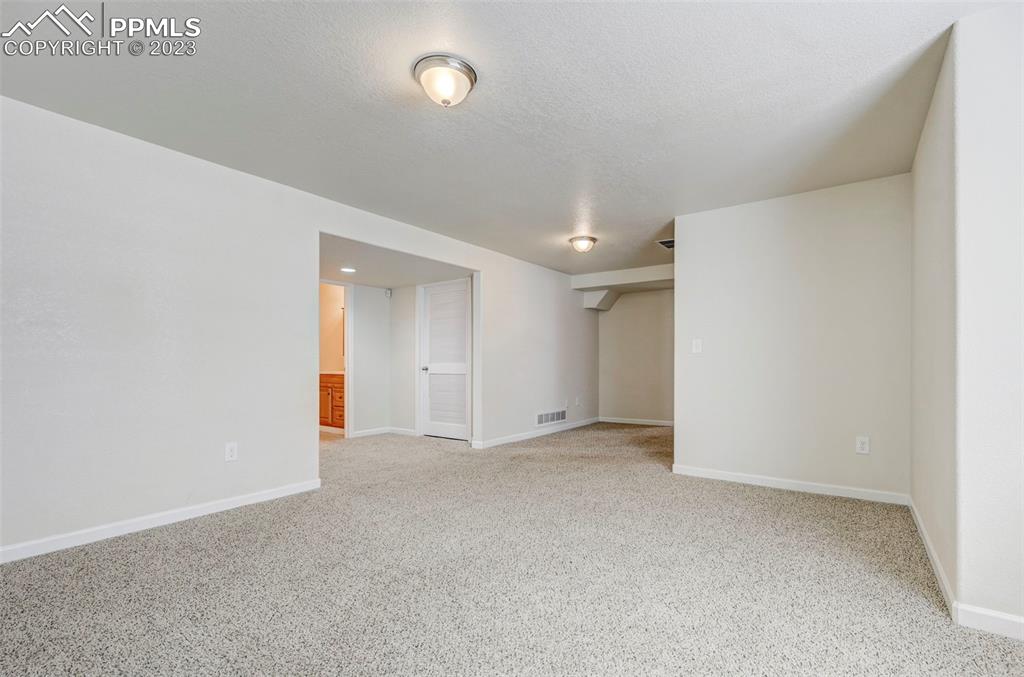 2170 Alpine Shadows View Colorado Springs, CO 80919 - Photo 42 of 49 an empty room with an entryway