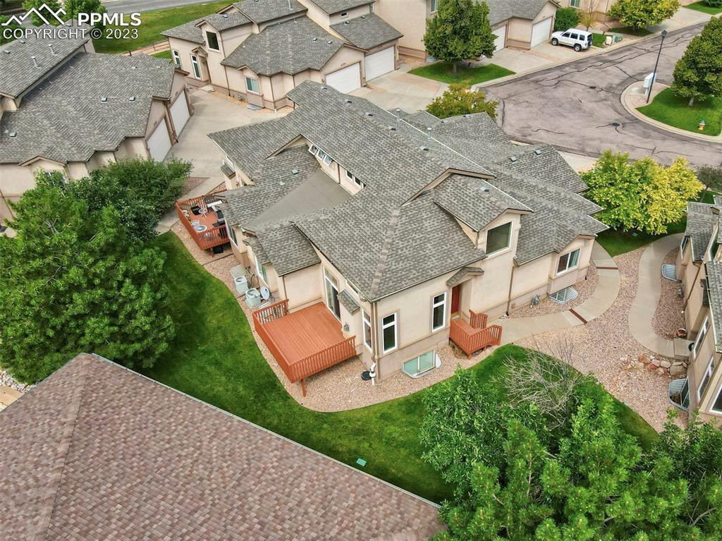 2170 Alpine Shadows View Colorado Springs, CO 80919 - Photo 47 of 49 an aerial view of a house with a garden and a yard