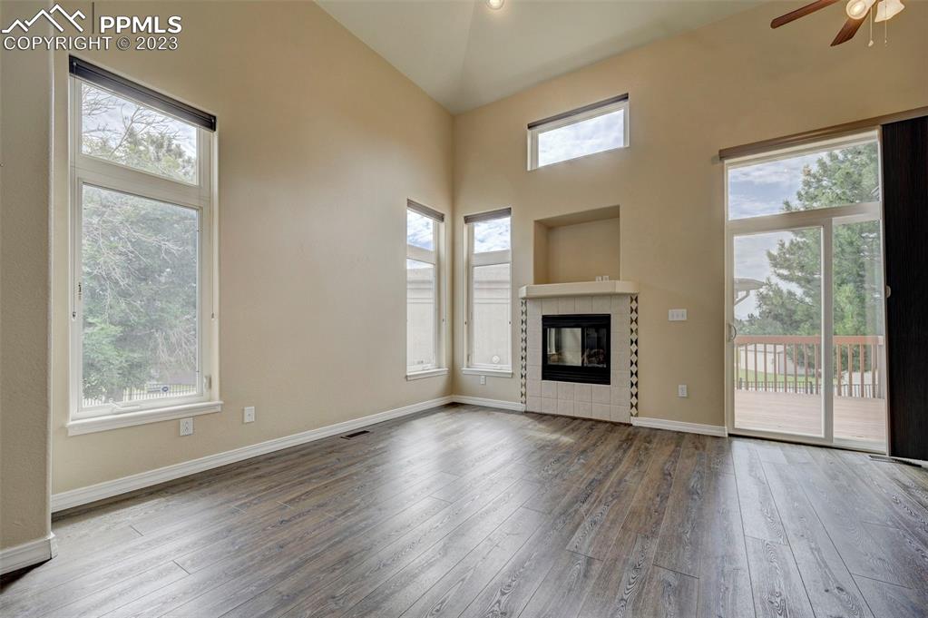 2170 Alpine Shadows View Colorado Springs, CO 80919 - Photo 48 of 49 a view of an empty room with wooden floor and a window
