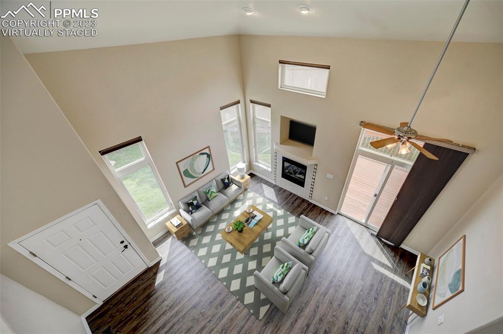 2170 Alpine Shadows View Colorado Springs, CO 80919 - Photo 6 of 49 a living room with furniture and a flat screen tv
