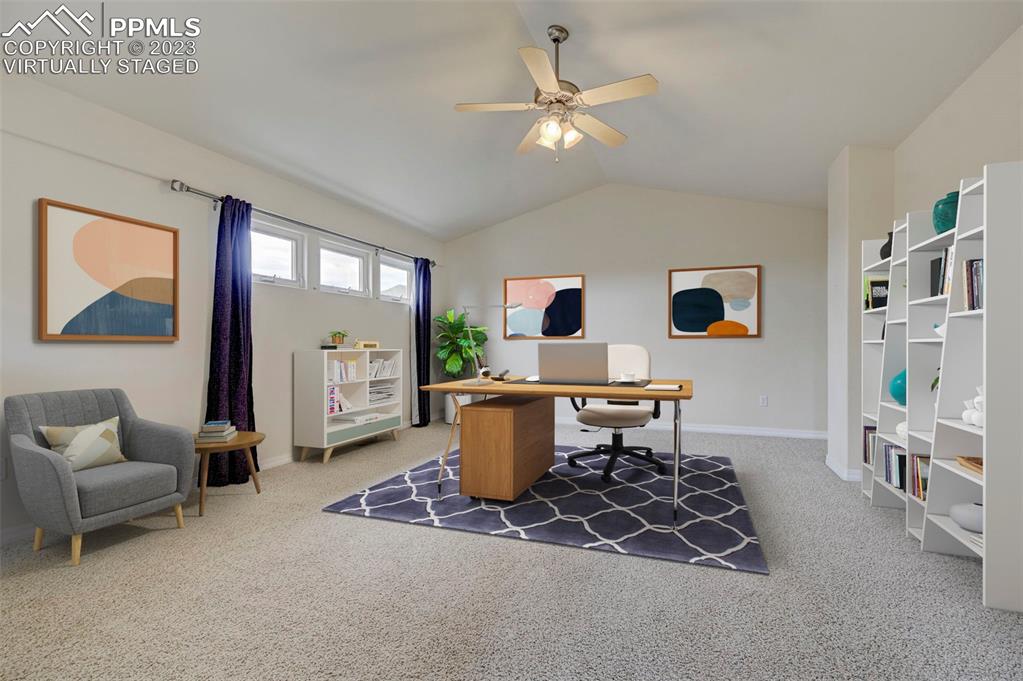2170 Alpine Shadows View Colorado Springs, CO 80919 - Photo 10 of 49 a living room with furniture a dining table and a large window