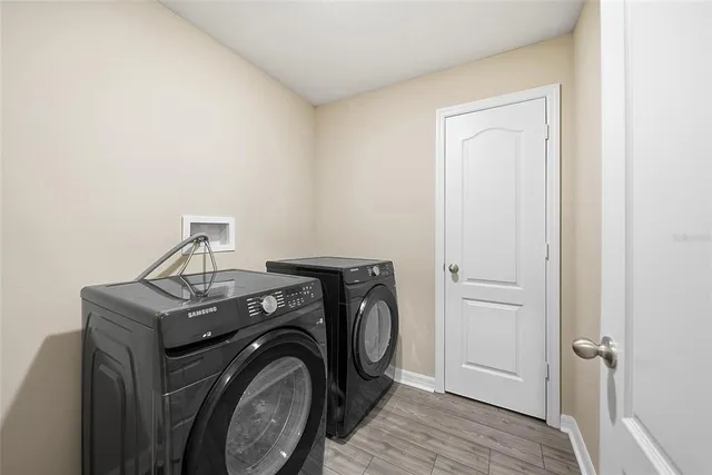 a utility room with dryer and washer